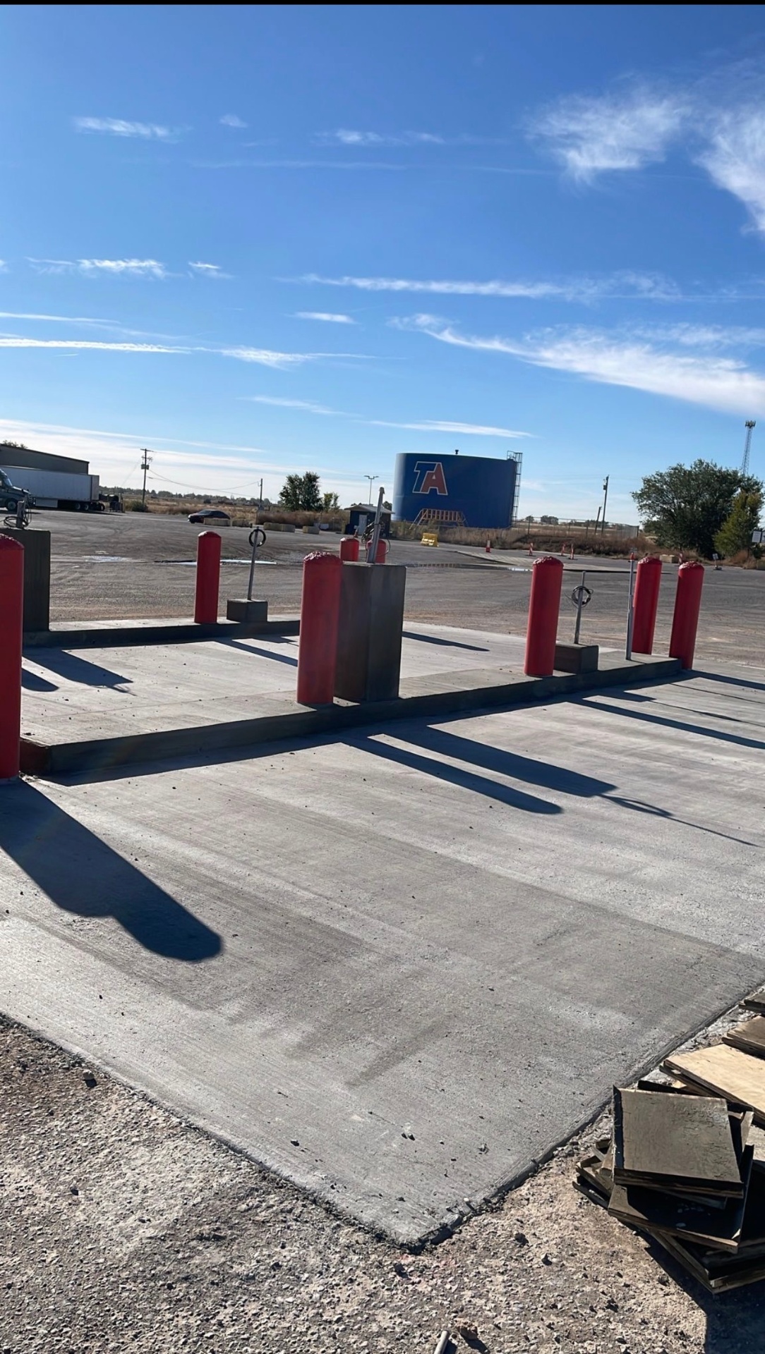 Commercial concrete pad with bollards