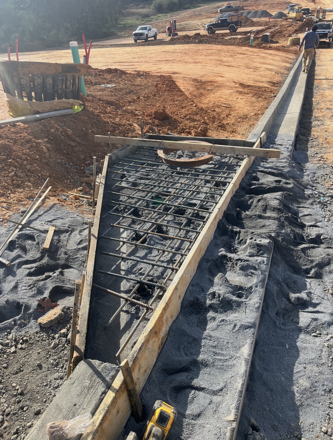 Reinforced concrete curb and roadwork
