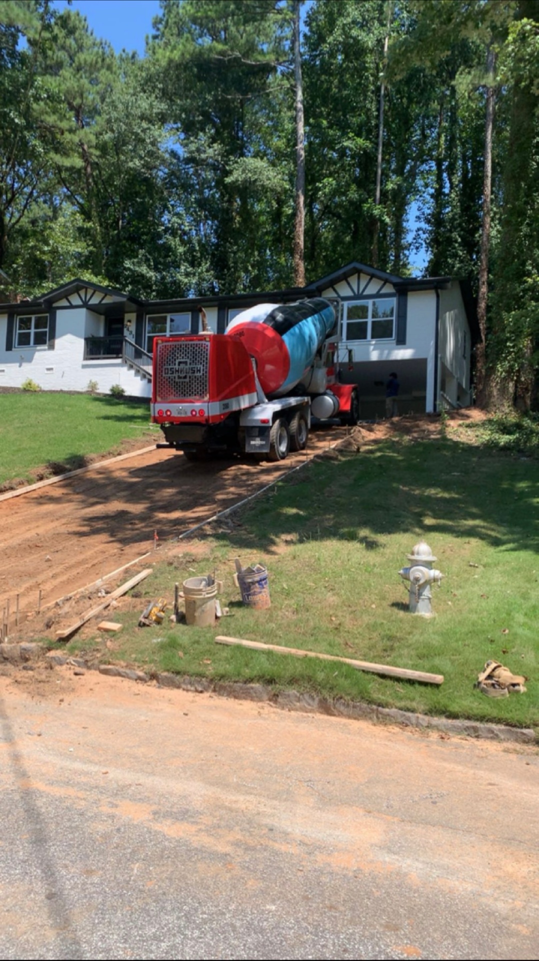 Concrete truck delivering driveway pour